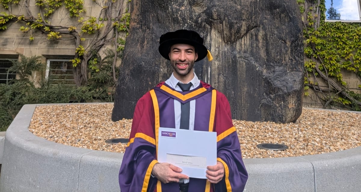 Mehdi Hellou in University of Manchester graduation robes